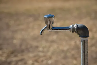 Close-up of a steel tap, representing hard water plumbing in St Albans and Hertfordshire