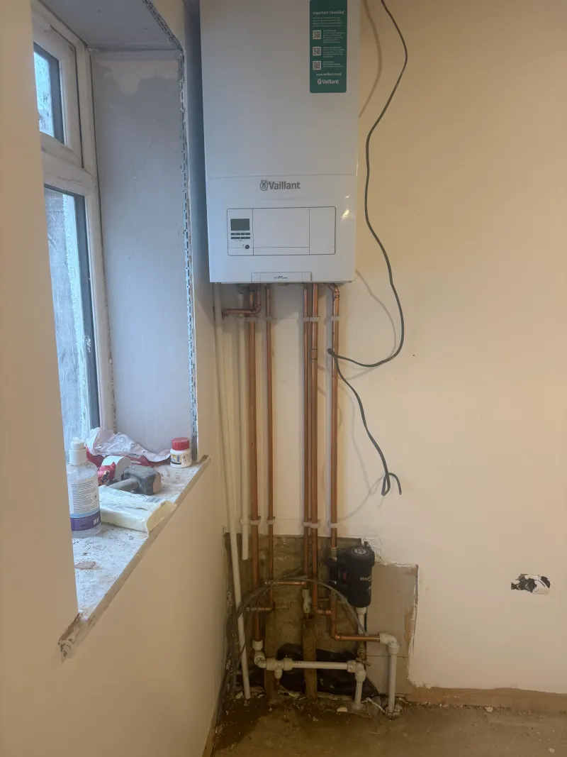 Vaillant boiler first-fix with magnetic system filter installed during a St Albans renovation — Pristine Gas Ltd