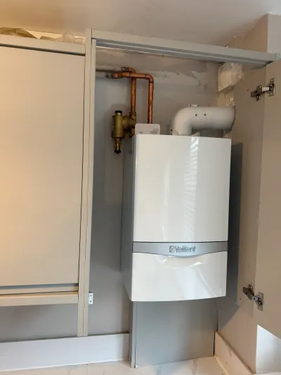 Low-profile Vaillant ecoTEC pro boiler fitted into a kitchen cupboard in Brixton SW2 — Pristine Gas Ltd